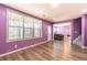 Spacious living area with large windows and open floor plan and hardwood style flooring at 5809 Savannah River, Atlanta, GA 30349