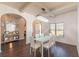 Bright dining room featuring hardwood floors, white table with chairs, and elegant chandelier at 5809 Savannah River, Atlanta, GA 30349