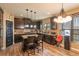 Charming kitchen with granite countertops, stainless steel appliances, dark cabinetry and hardwood floors at 5809 Savannah River, Atlanta, GA 30349