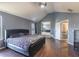 Spacious bedroom featuring a king-size bed, hardwood floors, and access to the en-suite bathroom at 5809 Savannah River, Atlanta, GA 30349