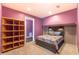 Comfortable bedroom with cozy decor and adjacent shelving; plenty of space for relaxing at 5809 Savannah River, Atlanta, GA 30349