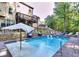 Inviting backyard pool with lounge chairs and manicured landscaping offers a private outdoor oasis at 5809 Savannah River, Atlanta, GA 30349