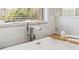 Close up of a bathtub with chrome faucet and sprayer with tile surround and bamboo bath tray at 149 Manor Lane, Woodstock, GA 30188