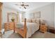 Cozy bedroom with warm wooden furniture, soft bedding, and elegant decorative accents for comfort at 149 Manor Lane, Woodstock, GA 30188