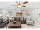 Bright living room featuring a large leather sofa, plush seating, and stylish decor with natural light at 149 Manor Lane, Woodstock, GA 30188