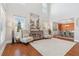 Spacious living room featuring high ceilings, hardwood floors, and a view into the dining room at 149 Manor Lane, Woodstock, GA 30188