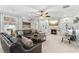 Spacious living room with a fireplace, leather sofa, and built-in shelving for a cozy feel at 149 Manor Lane, Woodstock, GA 30188