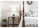 Bedroom detail of bedside table and four poster bed with natural light at 3481 Lakeside Ne Dr # 2207, Atlanta, GA 30326