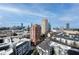 Expansive cityscape featuring modern buildings against a clear blue sky, showcasing urban living at 3481 Lakeside Ne Dr # 2207, Atlanta, GA 30326