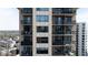 Image shows condo exterior with balconies and large windows at 3481 Lakeside Ne Dr # 2207, Atlanta, GA 30326