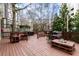 Large wooden deck with grill, firepit, and tables for neighborhood entertaining at 3481 Lakeside Ne Dr # 2207, Atlanta, GA 30326