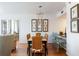 Well lit dining room featuring a modern chandelier and unique mirrors on the wall at 3481 Lakeside Ne Dr # 2207, Atlanta, GA 30326