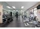 Bright gym with mirrored wall and various fitness machines and free weights at 3481 Lakeside Ne Dr # 2207, Atlanta, GA 30326