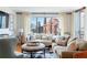 Inviting living room with neutral tones, hardwood floors, plush sofas, and stunning cityscape views at 3481 Lakeside Ne Dr # 2207, Atlanta, GA 30326