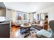 Inviting living room with hardwood floors, comfortable seating, and city views through large windows at 3481 Lakeside Ne Dr # 2207, Atlanta, GA 30326