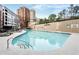 Large outdoor swimming pool with lounge seating available and highrise views at 3481 Lakeside Ne Dr # 2207, Atlanta, GA 30326