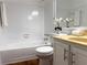 Neat bathroom featuring a tiled shower/tub combo and white vanity with laminate countertop at 904 Wentworth Ct, Alpharetta, GA 30022