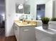 Cozy bathroom featuring a granite vanity, a toilet, and a decorative mirror at 904 Wentworth Ct, Alpharetta, GA 30022