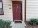 Exterior shot of the front door and unit number with fresh landscaping around the entryway at 904 Wentworth Ct, Alpharetta, GA 30022