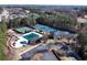 This beautiful aerial view shows the pool, playground, and tennis courts, providing many recreation options at 2460 Millwater Crossing Xing, Dacula, GA 30019