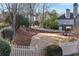 Picturesque backyard with a white picket fence and mature trees at 2460 Millwater Crossing Xing, Dacula, GA 30019