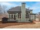 Rear exterior view showing a deck, grill, and arched windows at 2460 Millwater Crossing Xing, Dacula, GA 30019