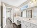 Bathroom featuring double sinks, vanity, and bright window at 2460 Millwater Crossing Xing, Dacula, GA 30019