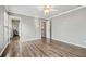 Bright bedroom featuring wood floors, ceiling fan, and neutral color palette at 2460 Millwater Crossing Xing, Dacula, GA 30019