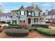 Charming two-story home with a covered porch and beautifully landscaped front yard at 2460 Millwater Crossing Xing, Dacula, GA 30019