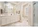 Elegant bathroom with marble flooring, a double vanity, and a glass-enclosed shower at 3000 Rivermeade Nw Dr, Atlanta, GA 30327