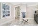 Bright bathroom featuring a glass shower, window with natural light, and elegant tile flooring at 3000 Rivermeade Nw Dr, Atlanta, GA 30327