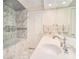 Beautiful bathroom features double sinks, stylish fixtures and finishes and a luxurious marble shower and tub at 3000 Rivermeade Nw Dr, Atlanta, GA 30327