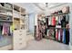 Organized walk-in closet with custom shelving, drawers, and ample hanging space for clothing and accessories at 3000 Rivermeade Nw Dr, Atlanta, GA 30327