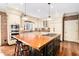 Well-appointed kitchen featuring white cabinets, a butcher block island, and stainless steel appliances at 3000 Rivermeade Nw Dr, Atlanta, GA 30327