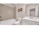 Bright bathroom showcases a tub and shower combination alongside a vanity at 6441 Se Brookside Blvd, Mableton, GA 30126