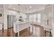 Bright kitchen with white cabinets, granite countertops, stainless steel appliances and hardwood floors at 6441 Se Brookside Blvd, Mableton, GA 30126