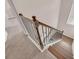 Carpeted staircase with modern railing showcasing the transition between floors at 6441 Se Brookside Blvd, Mableton, GA 30126