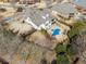 Aerial view of the home featuring a pool and outdoor lounge area, perfect for relaxing and entertaining at 102 Glenmill Way, Woodstock, GA 30188