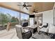 Relaxing back porch features ample seating, a cozy fire pit, and an outdoor grill at 102 Glenmill Way, Woodstock, GA 30188