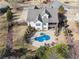 Aerial view showcases the in-ground pool and patio, ideal for outdoor entertaining and relaxation at 102 Glenmill Way, Woodstock, GA 30188