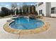 Backyard swimming pool and spa with stone accents and a basketball hoop at 102 Glenmill Way, Woodstock, GA 30188