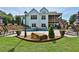 Spacious backyard with pool, spa, stone retaining wall and lush landscaping at 102 Glenmill Way, Woodstock, GA 30188