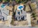 Aerial view showcasing the in-ground pool, patio, and well-maintained landscaping at 102 Glenmill Way, Woodstock, GA 30188