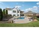 Spacious backyard with pool, spa, and deck ideal for relaxation and entertainment at 102 Glenmill Way, Woodstock, GA 30188