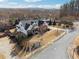 Charming two-story brick home featuring a landscaped yard and a welcoming front entrance at 102 Glenmill Way, Woodstock, GA 30188