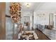 Inviting foyer with hardwood floors and decorative accents, leading to other rooms at 102 Glenmill Way, Woodstock, GA 30188