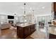 Spacious open-concept kitchen flows into the living and dining areas, perfect for entertaining and Gathering gatherings at 102 Glenmill Way, Woodstock, GA 30188