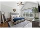 Relaxing main bedroom with vaulted ceilings, a large window, and tasteful decor at 102 Glenmill Way, Woodstock, GA 30188
