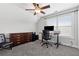 Office space features a large window, a ceiling fan, a desk with computer, an office chair, and a dresser at 102 Glenmill Way, Woodstock, GA 30188
