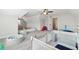 Large playroom with a play area, a safety fence, and bright natural light at 102 Glenmill Way, Woodstock, GA 30188